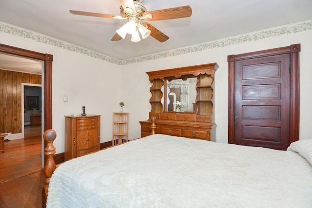 886 Canterbury St, Boston, MA 02131 - bedroom with wood finished floors, baseboards, a ceiling fan, and baseboard heating