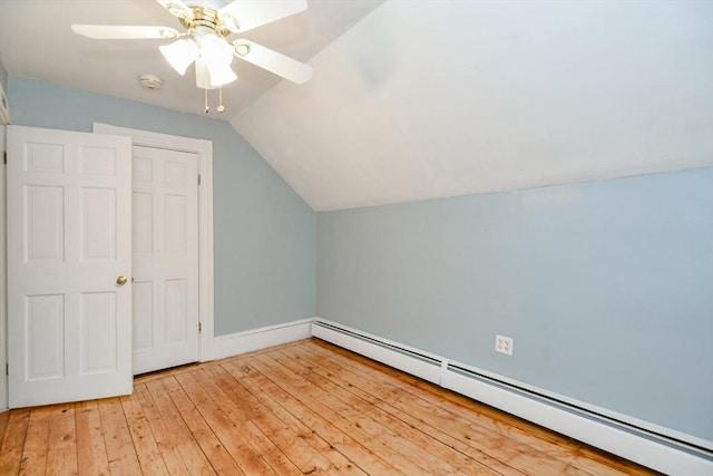 886 Canterbury St, Boston, MA 02131 - additional living space with a baseboard radiator, lofted ceiling, a ceiling fan, light wood-type flooring, and baseboards