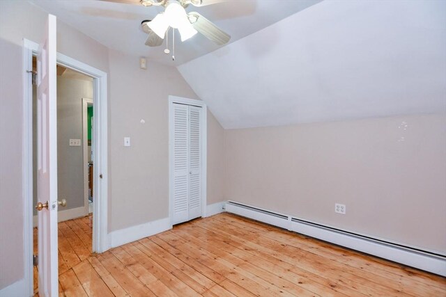 886 Canterbury St, Boston, MA 02131 - additional living space featuring a baseboard radiator, lofted ceiling, light wood finished floors, ceiling fan, and baseboards