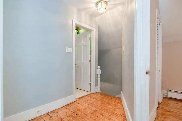 886 Canterbury St, Boston, MA 02131 - hall with light wood-type flooring, vaulted ceiling, a baseboard radiator, and baseboards