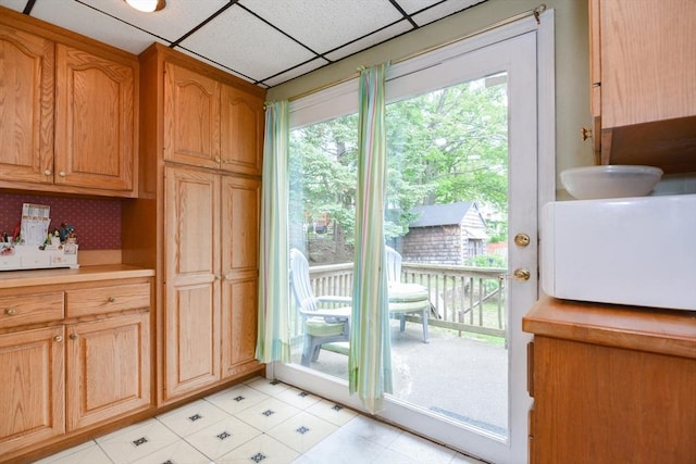 886 Canterbury St, Boston, MA 02131 - kitchen with white microwave, light countertops, and a drop ceiling