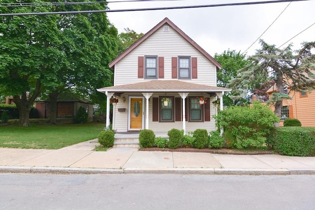 886 Canterbury St, Boston, MA 02131 - view of front of property featuring a porch and a front lawn