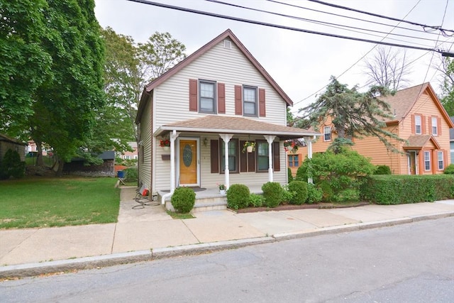 886 Canterbury St, Boston, MA 02131 - view of front of house featuring covered porch and a front lawn