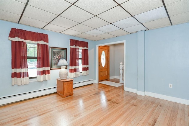 886 Canterbury St, Boston, MA 02131 - entryway featuring a baseboard radiator, a paneled ceiling, hardwood / wood-style flooring, and baseboards
