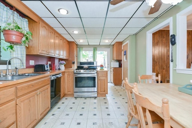 886 Canterbury St, Boston, MA 02131 - kitchen with gas range, black dishwasher, a sink, light countertops, and ceiling fan