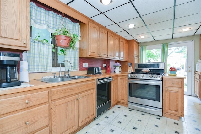 886 Canterbury St, Boston, MA 02131 - kitchen featuring stainless steel gas stove, black dishwasher, a sink, light countertops, and white microwave