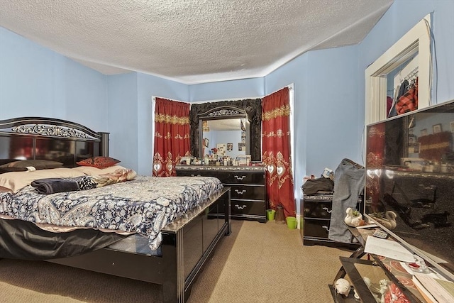 bedroom with carpet floors and a textured ceiling