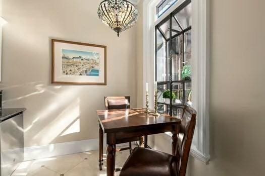 dining area featuring plenty of natural light and baseboards