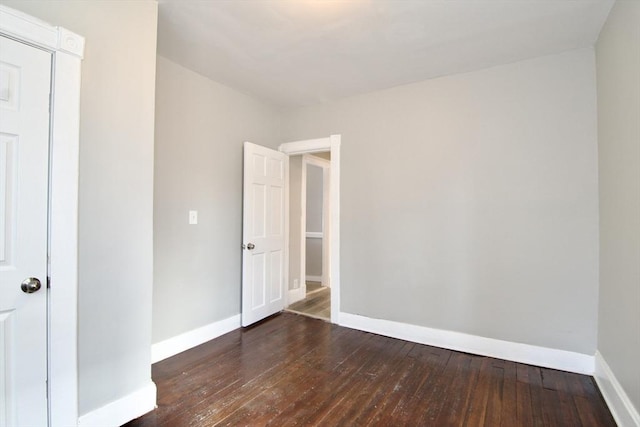 unfurnished bedroom featuring dark wood-type flooring