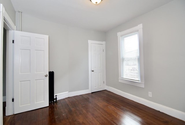 empty room featuring dark hardwood / wood-style floors