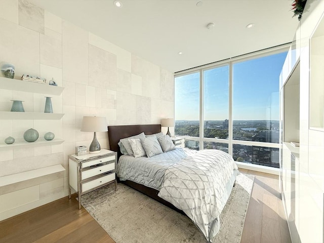 188 Brookline Ave Unit Ph28C, Boston, MA 02215 - bedroom featuring wood finished floors, expansive windows, and recessed lighting