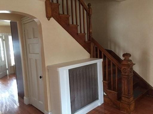 70-72 Prospect Ave, Quincy, MA 02170 - staircase featuring arched walkways and wood finished floors