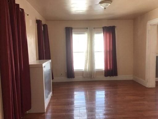 70-72 Prospect Ave, Quincy, MA 02170 - spare room featuring wood finished floors and baseboards
