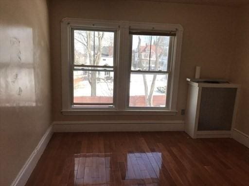 70-72 Prospect Ave, Quincy, MA 02170 - unfurnished room featuring wood finished floors, baseboards, and plenty of natural light