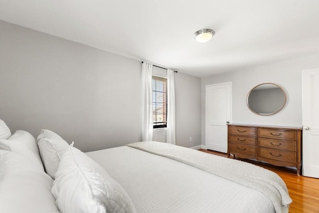 bedroom featuring light wood-style floors
