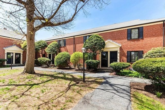 view of front of house featuring brick siding