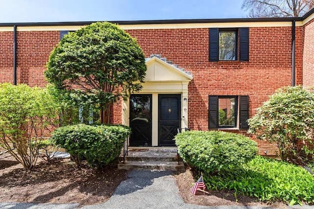 view of front of house with brick siding