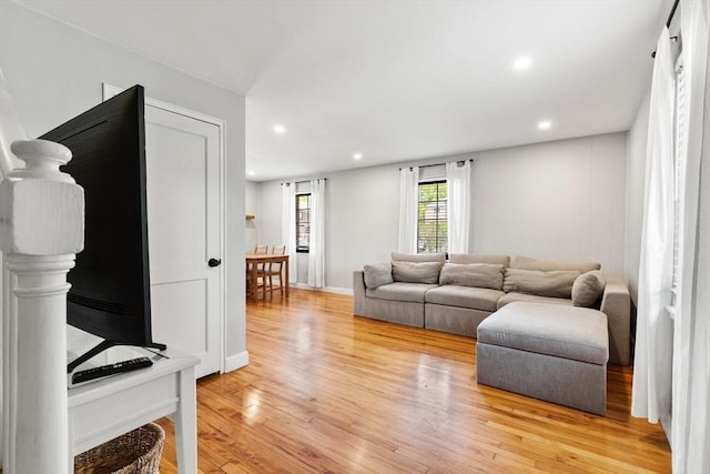 living area featuring recessed lighting and light wood finished floors