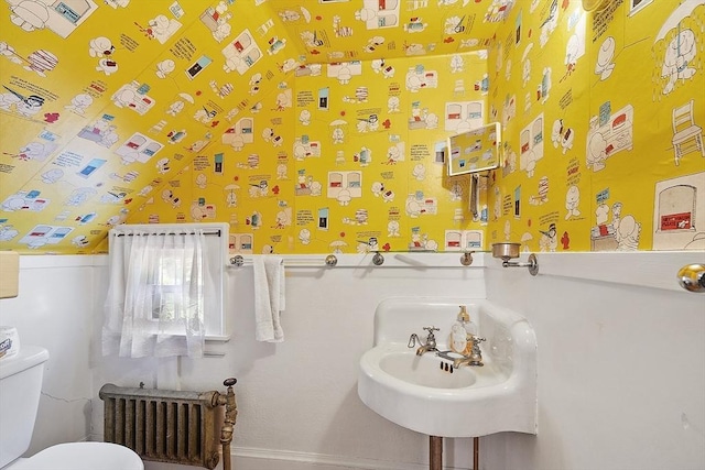 298 Highland St, Worcester, MA 01602 - bathroom featuring radiator heating unit and toilet