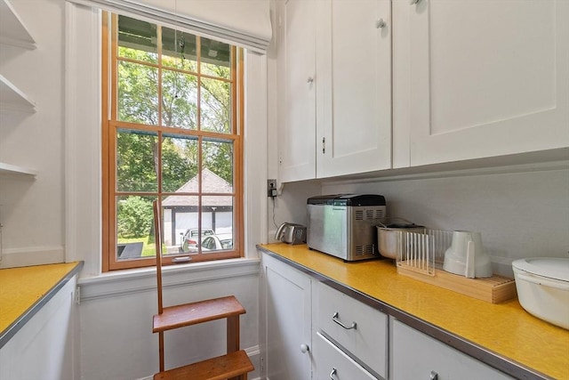 298 Highland St, Worcester, MA 01602 - kitchen with white cabinetry and light countertops