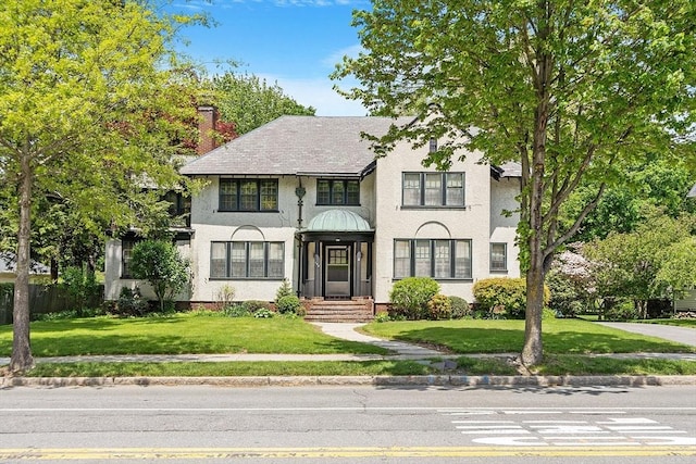 298 Highland St, Worcester, MA 01602 - view of front of home featuring stucco siding and a front lawn