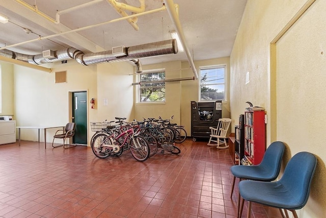 54 Forest St Unit 411, Medford, MA 02155 - garage with washer / clothes dryer and a textured wall