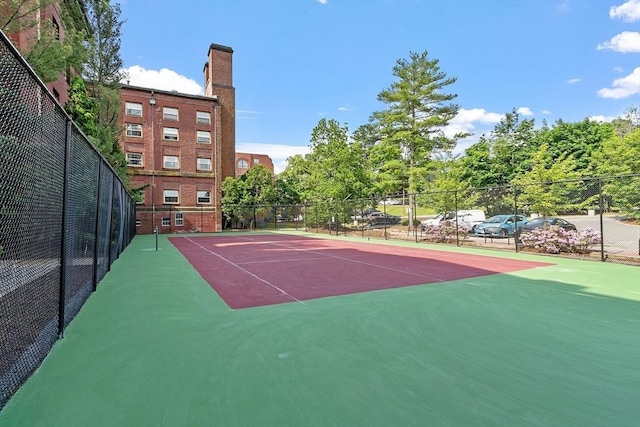 54 Forest St Unit 411, Medford, MA 02155 - view of tennis court featuring community basketball court