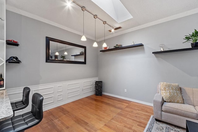 54 Forest St Unit 411, Medford, MA 02155 - office with a skylight, light wood finished floors, ornamental molding, and track lighting