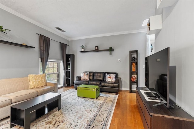 54 Forest St Unit 411, Medford, MA 02155 - living area with light wood finished floors and ornamental molding