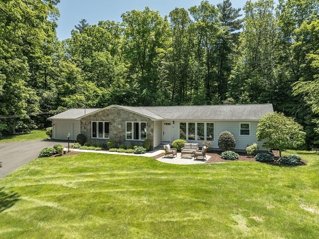 24 Skyridge Dr, Somers, CT 06071 - view of front facade featuring asphalt driveway, an attached garage, an outdoor living space, and a front lawn