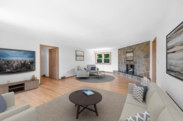 24 Skyridge Dr, Somers, CT 06071 - living room with a stone fireplace and wood finished floors