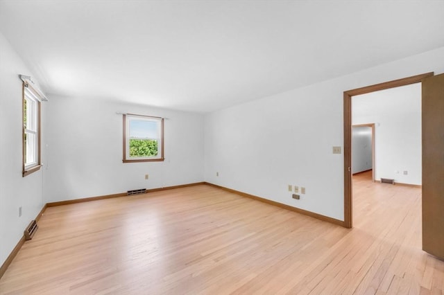 24 Skyridge Dr, Somers, CT 06071 - empty room featuring plenty of natural light, light wood finished floors, and baseboards