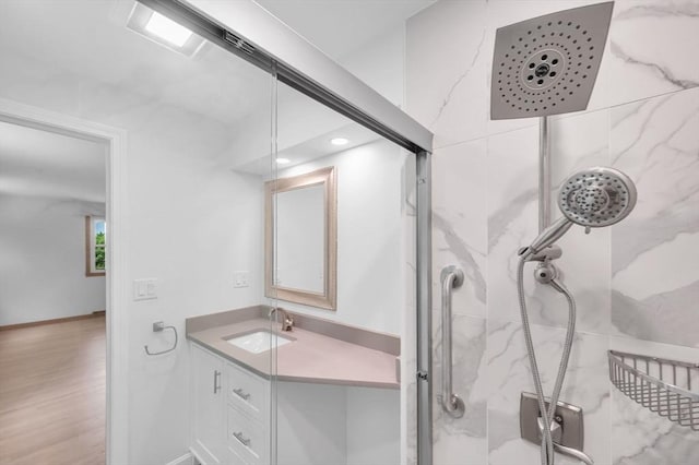 24 Skyridge Dr, Somers, CT 06071 - bathroom featuring a marble finish shower, vanity, wood finished floors, and recessed lighting