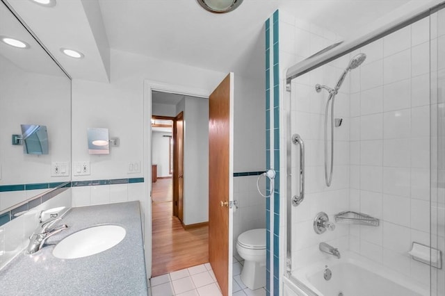 24 Skyridge Dr, Somers, CT 06071 - bathroom with tile walls, tile patterned floors, shower / tub combination, toilet, and vanity