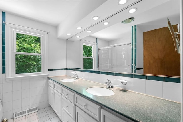 24 Skyridge Dr, Somers, CT 06071 - full bath with plenty of natural light, double vanity, tile walls, a shower stall, and recessed lighting