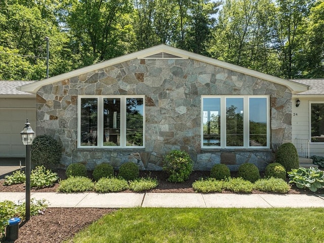 24 Skyridge Dr, Somers, CT 06071 - view of front facade with stone siding and a shingled roof
