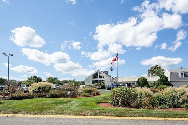 view of property's community featuring a yard