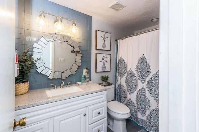 bathroom featuring tasteful backsplash, visible vents, a shower with shower curtain, toilet, and vanity