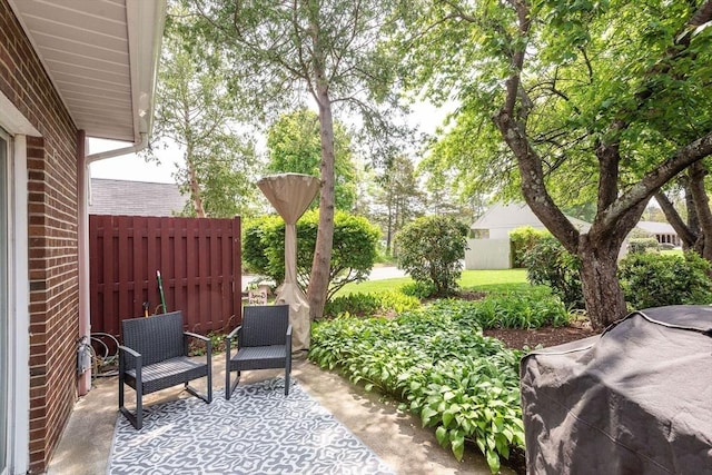 view of patio featuring fence