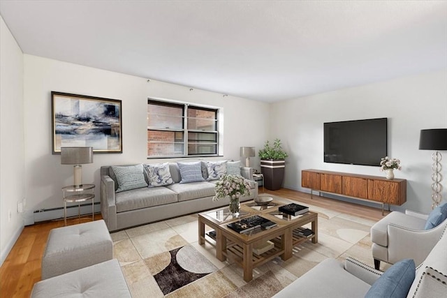 4925 Washington St Unit 304, Boston, MA 02132 - living room with a baseboard radiator and light wood-style floors