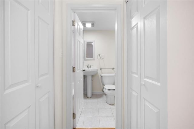 4925 Washington St Unit 304, Boston, MA 02132 - bathroom with a closet and tile patterned flooring