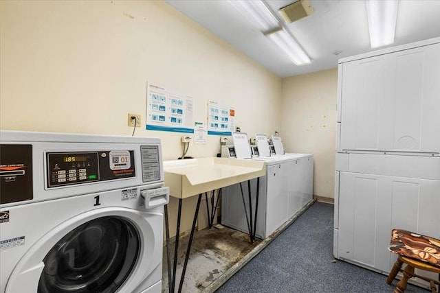 4925 Washington St Unit 304, Boston, MA 02132 - communal laundry room featuring washer and clothes dryer
