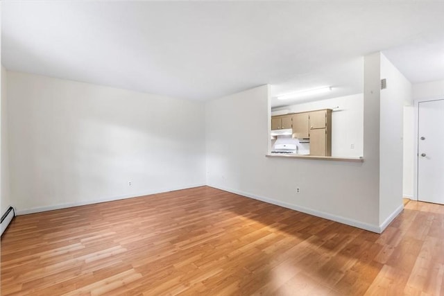 4925 Washington St Unit 304, Boston, MA 02132 - unfurnished living room featuring light wood finished floors and baseboards