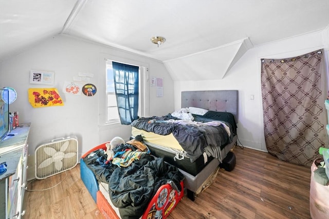 bedroom featuring vaulted ceiling and dark hardwood / wood-style flooring