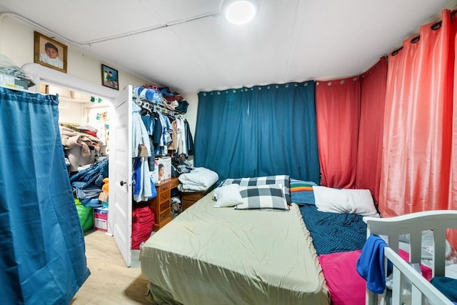 bedroom with light hardwood / wood-style floors