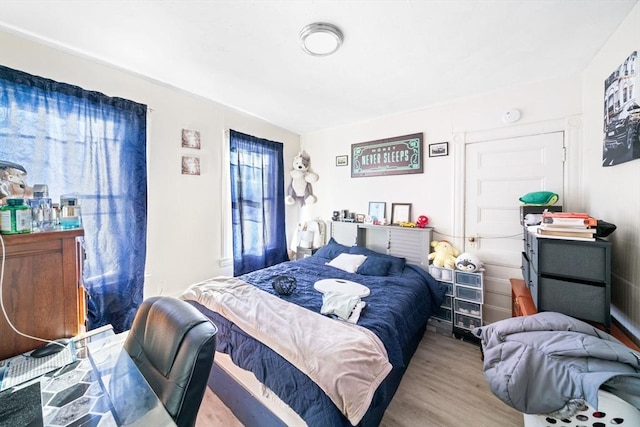 bedroom with light hardwood / wood-style flooring