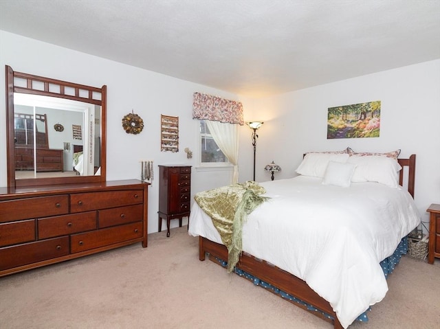 bedroom with light carpet