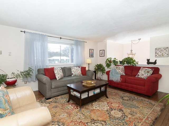 living room featuring hardwood / wood-style floors and a chandelier