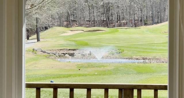 exterior space with a water view and view of golf course