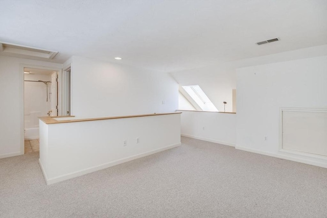 spare room featuring baseboards, light carpet, recessed lighting, and visible vents